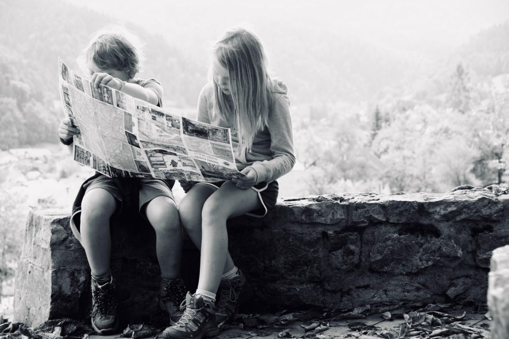Children reading newspaper journalism Brazil