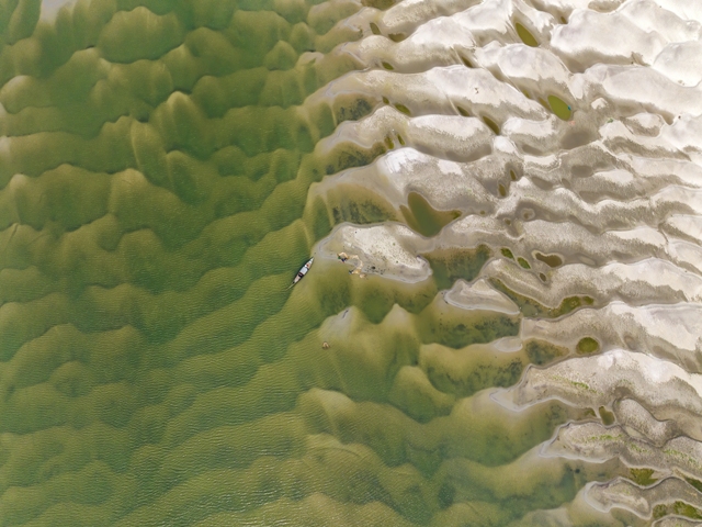 Área carbonizada do rio Padma, em Rrajshahi, Bangladesh. Foto premiada no concurso de fotografia sobre meio ambiente