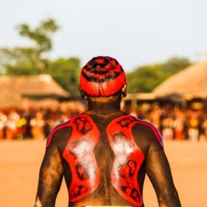 Índio com o corpo pintado de vermelho na Aldeia Piyulaga,Xingu, Mato Grosso