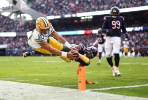 Jogo de futebol americano. A imagem foi premiada no concurso de fotografia esportiva