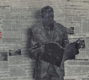 Estátua homem lendo jornal