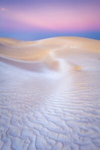 O colorida do céu e da areia nas Dunas de Açúcar em Omã. A imagem foi premiada no concurso de fotos de natureza