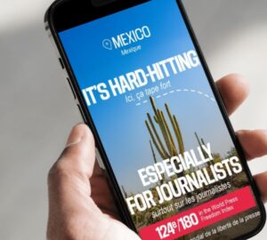 Celular exibindo campanha denunciando destinos turísticos de países perigosos para jornalistas